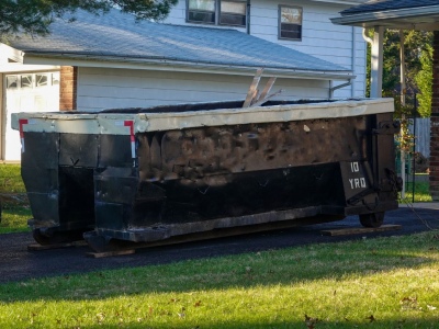 Why Wood Boards Protect Your Driveway From a Dumpster Rental