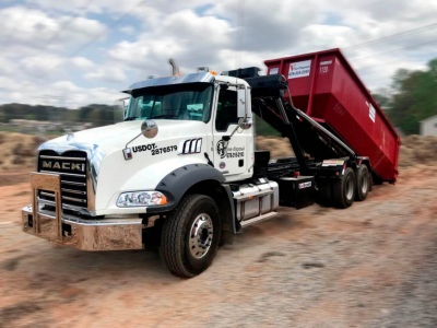 The Difference Between a Roll-Off Dumpster and Dump Trailer