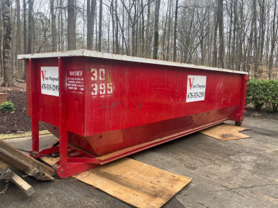 Why Wood Boards Protect Your Driveway From a Dumpster Rental