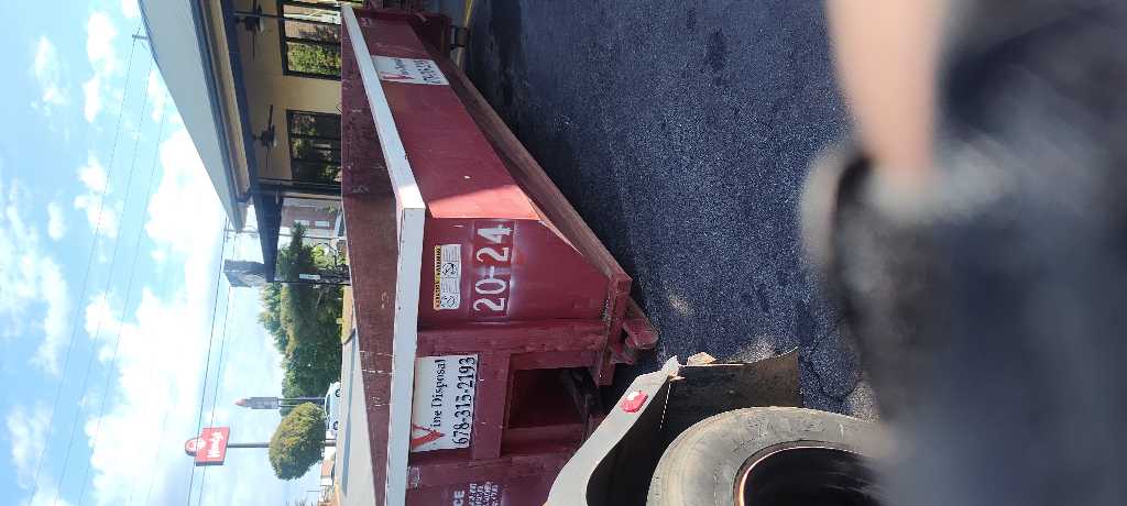 Vine Disposal roll-off dumpster delivered to a residential driveway in Acworth, GA