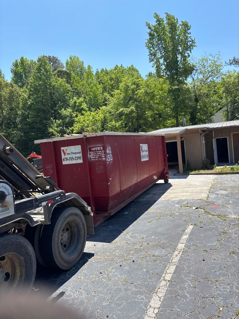Vine Disposal roll-off dumpster delivered to a residential driveway in Ben Hill, GA